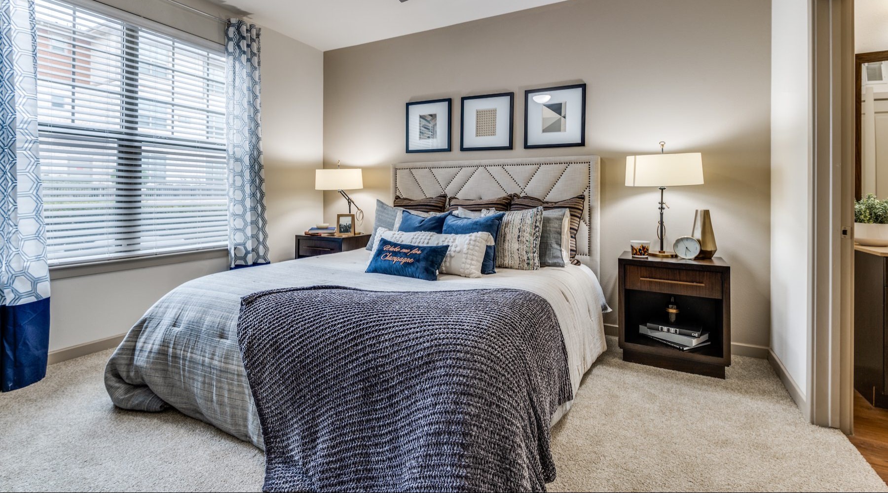 a bedroom with a bed and two nightstands