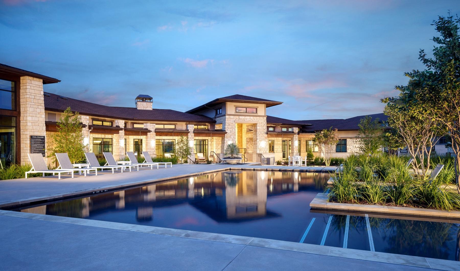 a swimming pool in front of a house
