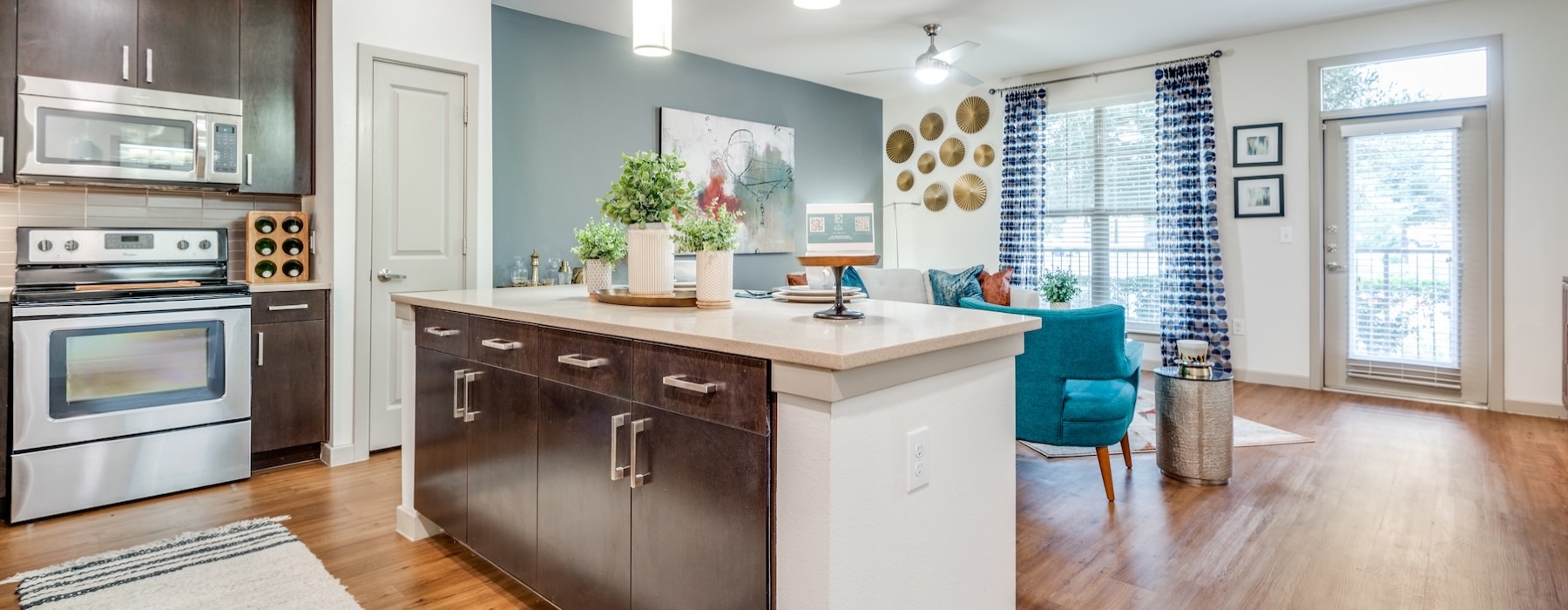 a kitchen with a marble island